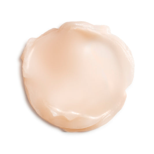 Eminence Organics Camellia Glow Solid Face Oil — texture swatch applied to skin